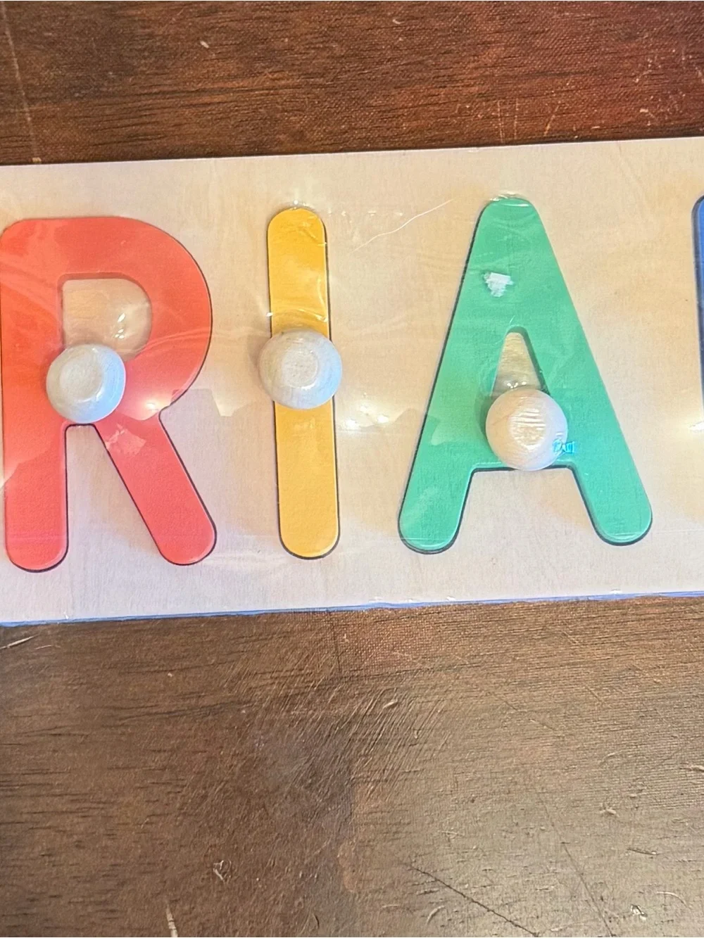 Kids Wooden Letter Puzzle that spells Uriah  - Multicolor (Red, Yellow, Green)